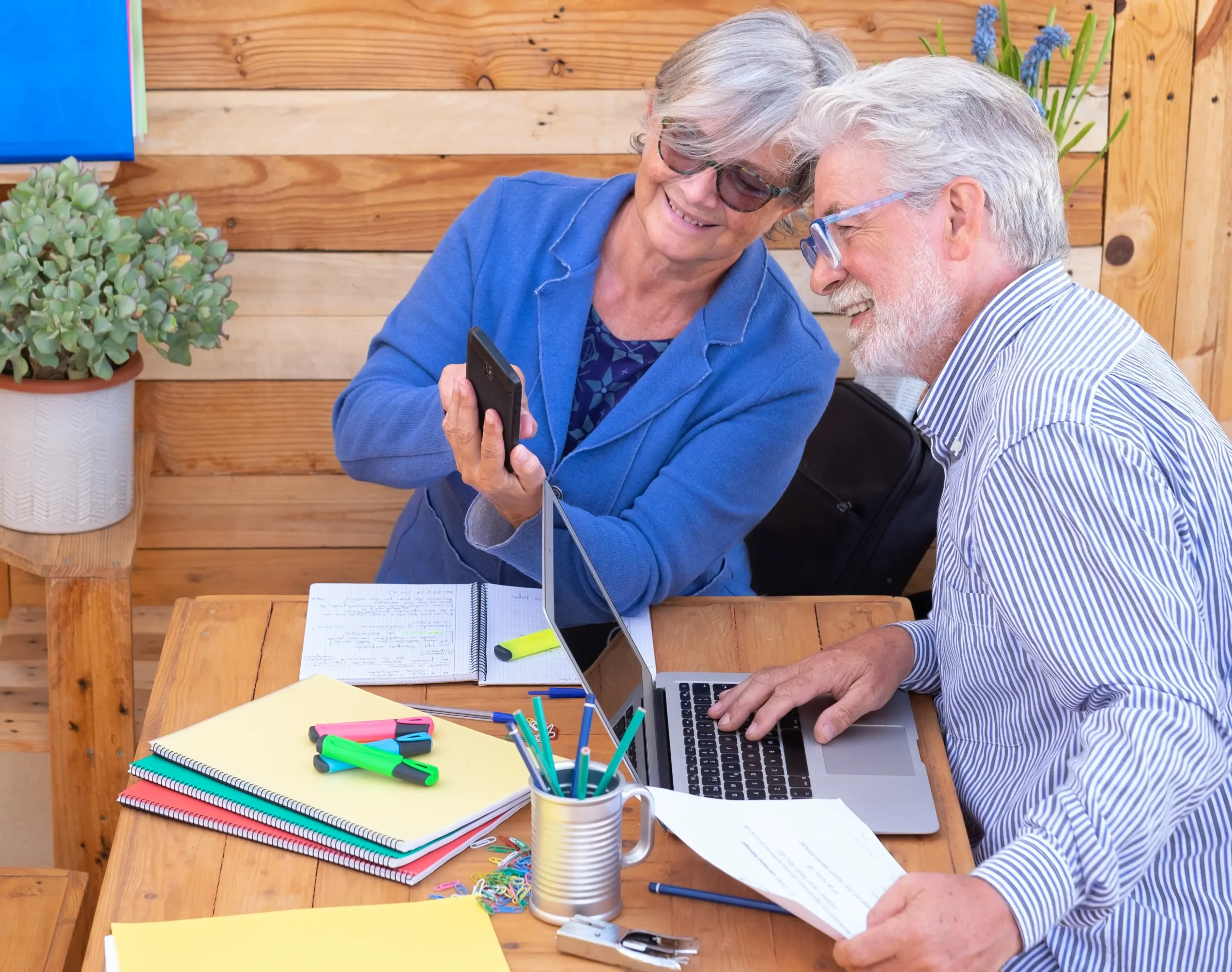 senior-woman-with-man-using-phone